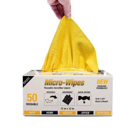 Hand pulling yellow cloth from Edgeless 200 GSM Microfiber Cleaning Cloths 12x12in 50 Pack With Dispenser