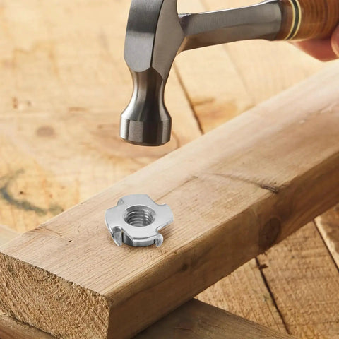 4 Pronged Tee Nuts 1/4-20 Stainless Steel 304 for Wood Climbing Walls Furniture being installed in wood with hammer.