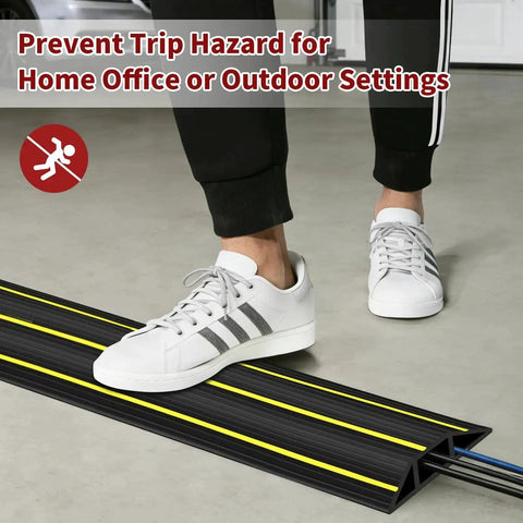 Person stepping over 6 Ft Floor Cable Cover With Three Large Cord Channels For Wires On The Floor Beefy Heavy Duty PVC Duct Black