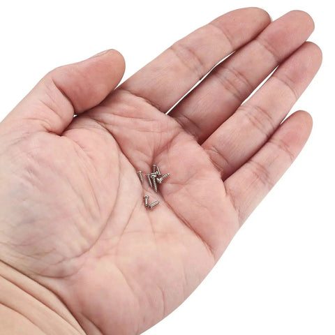 Hand holding 1200 Pcs Mini Screw Kit M1 M1.2 M1.4 M1.7 Micro Phillips Head Pan Screws For Electronics Sunglasses Watches Self Tapping
