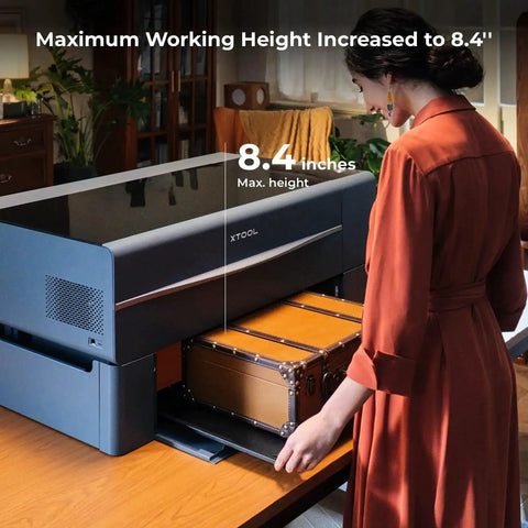 Riser Base Upgrade For P2 CO2 Laser Cutter Lets You Engrave Ultra Thick Materials Up To 8.4 Inches, A Great Partner For Auto Conveyor Feeder, Boosts Batch Processing And Workpiece Clearance For Thick Engravings From xTool viewed from side with a suitcase inside.