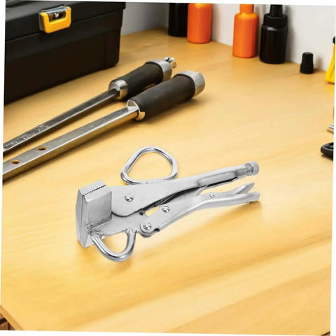 Heavy Duty Pulling Pliers Clamp For Auto Body Sheet Metal Repair on a workbench, showcasing steel construction and locking mechanism.
