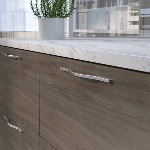 Brushed Nickel Modern Arched Cabinet And Drawer Pull Handle for kitchen and bath, installed on wooden cabinets.