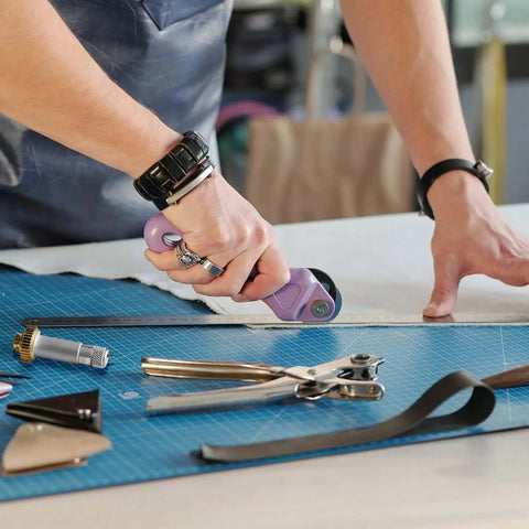 Person using German Tungsten Carbide Knife Blade 12 Mm With Drive Housing And Silicone Protective Cover for cutting fabric.