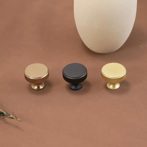 Three cabinet knobs in brushed gold, black, and gold knurled finish, part of 10 Pack Brushed Gold Cabinet Knobs With Gold Knurled Drawer Pulls