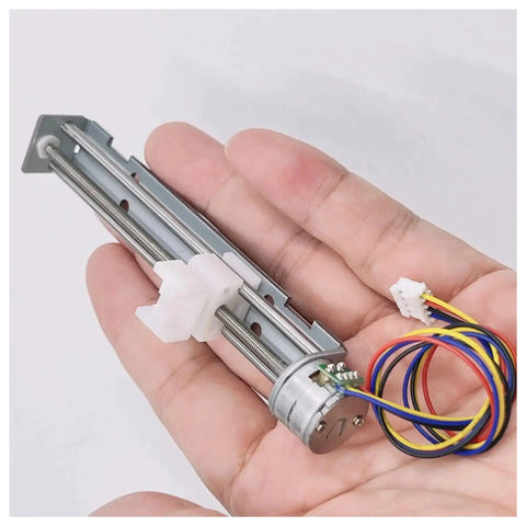 Hand holding Dc Stepper Motor Driver 5V To 9V 2 Phase 4 Wire with 80mm linear actuator for CNC machines and 3D printing projects