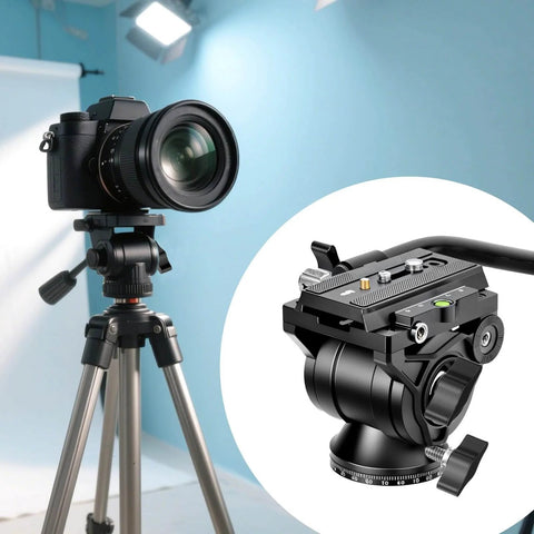 Camera on tripod with close-up of advanced fluid head for videography in studio setting
