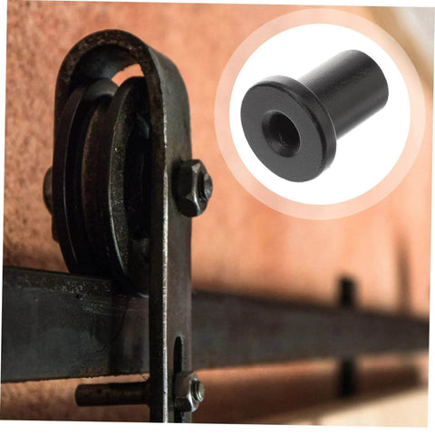 Close-up of Five Piece Barn Door Track Spacers And Connectors Kit, showing black steel spacer on sliding door hardware.