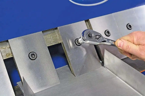 Adjusting removable fingers on 48 Inch Pan And Box Sheet Metal Brake with ratchet tool for precise 135 degree bends and versatility.
