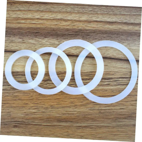 5 Pack Silicone Sealing Rings Replacement Gaskets For Coffee Pot Lids Espresso Pots And Canning Jars displayed on wooden surface