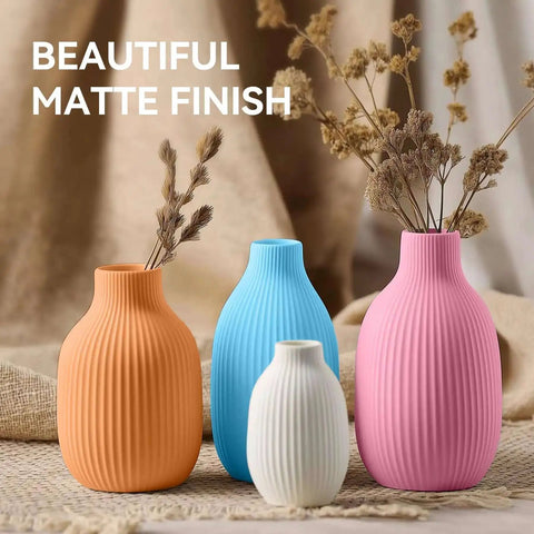 Colorful matte finish vases grouped together, showcasing elegant design with dried flowers displayed for decorative appeal.