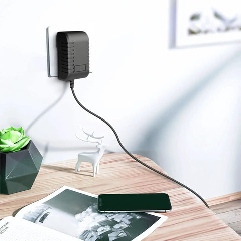 9V ACDC Power Adapter For NordicTrack RW200 Rowing Machine Replacement Charger plugged into wall, cable visible on desk