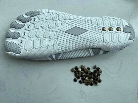 Copper Grounding Rivets For Shoes, Barefoot Earthing Accessories, Black Small installed on white shoe sole with extra rivets.