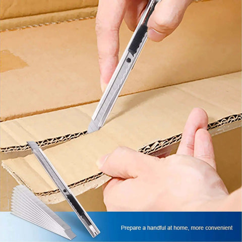 Hand using cutting knife from Pro Grade Seven Piece Vinyl Wrap Tool Kit For Window Tinting Car Auto Tinting Tools Set