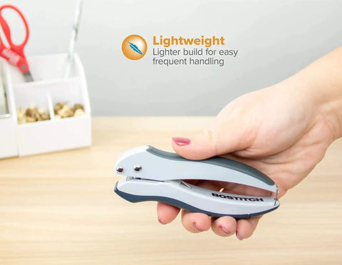 EZ Squeeze One-Hole Paper Punch Pack of 3, 10 Sheet Capacity, lightweight design held in hand on wooden desk.