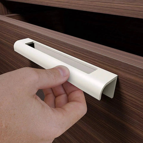 Installing self adhesive edge fingerpull door handle on wooden drawer front for quick transform of kitchen fronts and furniture.