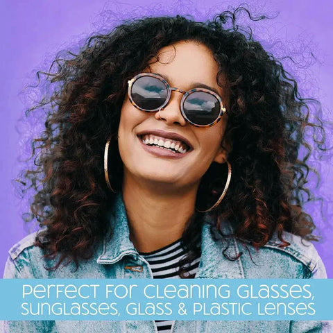 Smiling person wearing sunglasses, highlighting use of SmudgeGuard Lens Wipes 100 Count For Glasses Cameras Non Scratching.