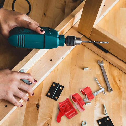 Person using drill and Lightweight 1/2 Inch Quick Release Pipe Clamp for Woodworking and Wood Gluing, red clamps visible.