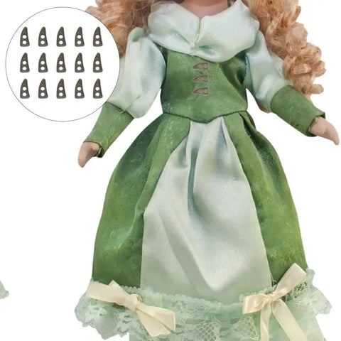 Doll wearing green dress with 100Pc Mini Buttons For Doll Clothes DIY Fasteners Kit, shown as tiny black button options.