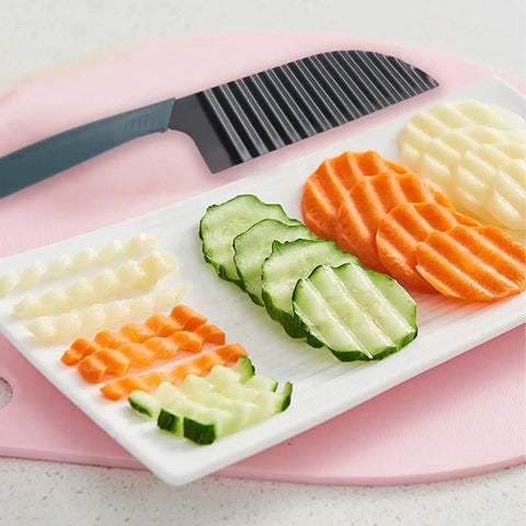 Restaurant-Quality Crinkle Cutter Knife For Veggies And Potatoes with crinkle-cut cucumber, carrot, and potato slices on plate