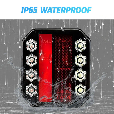 Trailer light with black housing, red central lens and hex LED side lights; IP65 waterproof.