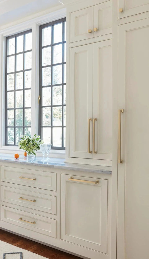 Lintel 18 Inch Center To Center Champagne Bronze Appliance Pull on large white cabinets in kitchen