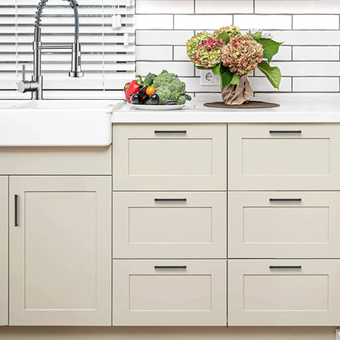 White kitchen with 30 pack matte black cabinet pulls with five inch center to center holes slim square kitchen handles on drawers.