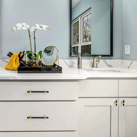 Installed Ten Pack 3 Inch Hole Center Black And Gold Cabinet Pulls Matte Black Hexagon Bar With Brushed Gold Bases on bathroom vanity