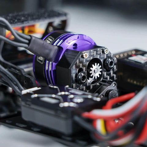 Close-up of Fat Viper 2204 2400KV Brushless Outrunner Motor with mount installed on RC crawler Axial SCX24 model