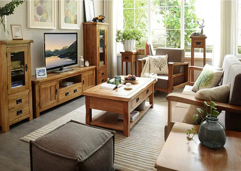 Cozy living room with wooden furniture, including a coffee table, TV stand, and armchairs, decorated with plants and artwork.
