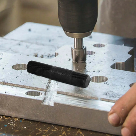 Hydraulic Hole Punch Driver Kit with draw dies used for metal sheet punching, showing manual hole cutter tool in action