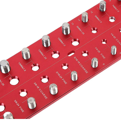 Close-up of Nut And Bolt Thread Checker Set With 28 Hole Metal Gauge For Metric And Standard Threads showing sizes on red metal surface.