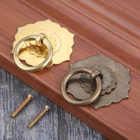 Antique Brass Ring Pulls For Cabinets And Doors Hexagon Flower Design Drawer Handles with screws on wooden surface