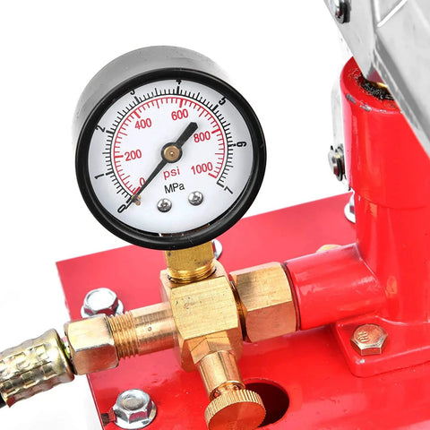 Close-up of a red Rugged 1000 PSI Manual Hydraulic Pressure Test Pump For Pipes And Valves gauge and fittings, rust resistant iron