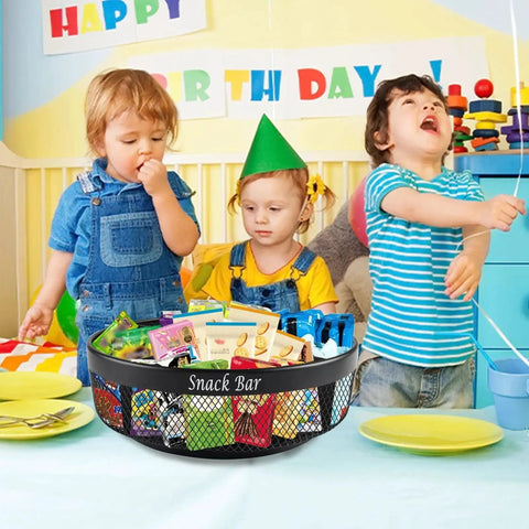 Snack Organizer Turntable For Countertop In Black Metal With Divider 4 Compartment Spinning Tray Go To Lazy Susan displayed at a birthday party with children.