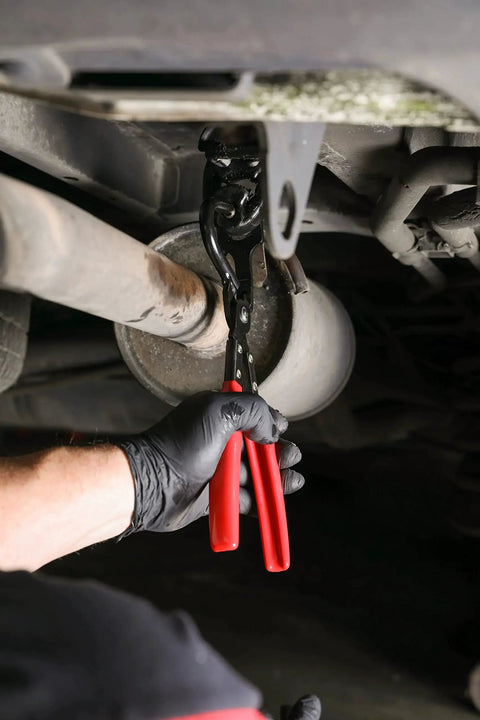 Heavy Duty Exhaust Hanger Removal Pliers With 25 Degree Offset For Hard To Reach in use under car exhaust system