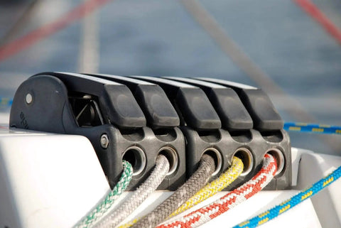 Installed Spinlock XTS rope clutch, single alloy unit for 8–14 mm rope, on boat deck with braided lines
