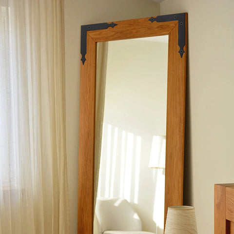 Wooden mirror frame with Four Piece L Shaped Corner Brackets Set In Black Carbon Steel For Sliding Barn Doors And Farmhouse Decor.