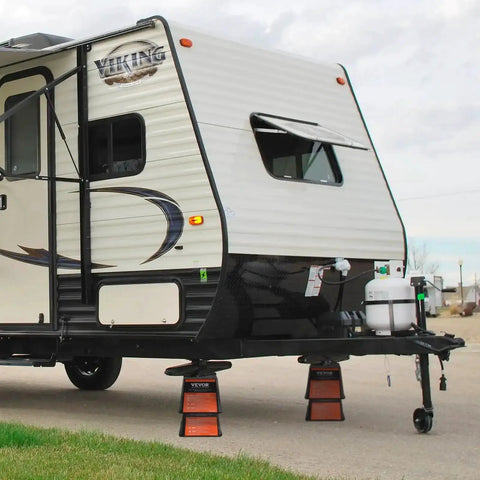 RV supported by leveling blocks, showcasing 6000 lbs capacity polypropylene stabilizer blocks for trailers and campers