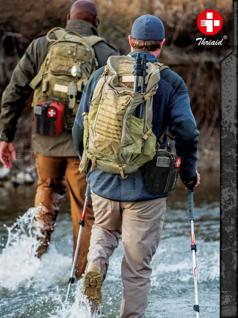 Two hikers with backpacks and Ultimate Survival First Aid Kit For Bleeding Control And Wound Care With Israeli Bandage Tourniquet on trails