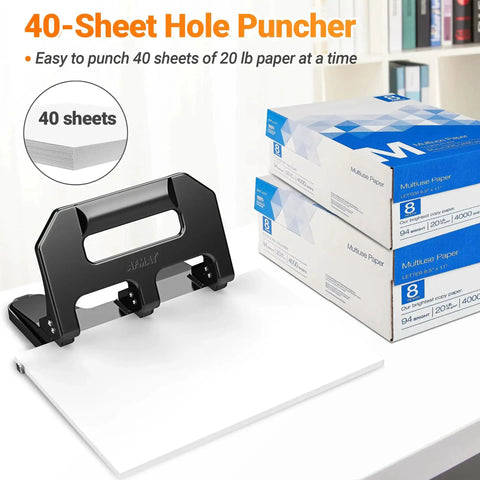 Heavy Duty 3 Hole Puncher For Binders With 40 Sheet Capacity, metal construction, black finish, alongside reams of paper.