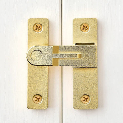 Front view of 180 Degree Flip Barn Door Lock in Gold mounted on a white door showcasing heavy-duty gate latch design.
