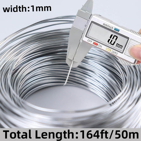 Close-up of 18 Gauge Aluminum Craft Wire 1mm 164ft showing thickness measurement and spool details for crafting and sculpting.
