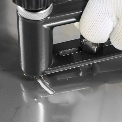 Close-up of Adjustable Sheet Metal Hole Cutter With Two Drill Bits Pro Grade Circle Hole Cutter in use on metal surface.