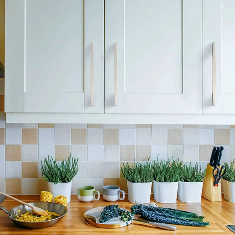 Modern kitchen with 10 Pack 5 Inch Brushed Satin Nickel Cabinet Handles For Kitchen Cabinets Cupboards And Drawers installed on white cabinets.