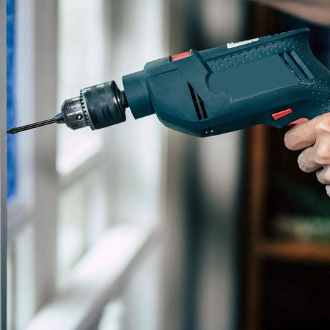 Hand using drill with Five Piece Dry Diamond Drill Bit Set For Masonry And Tile With 6mm Core Bits And One Quarter Inch Diameter Vacuum Brazed