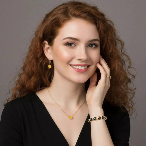 Woman wearing gold crown charm necklace and earrings, showcasing 60 Pcs Crown Charms Set In Gold And Silver For DIY Jewelry Making Crafts.
