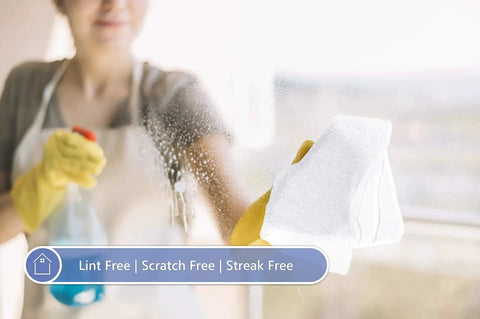 Person cleaning glass with Tough As Nails Cotton Shop Towels 12x14 Inches Pack Of 50 Plus 5 Bonus Reusable Cleaning Rags