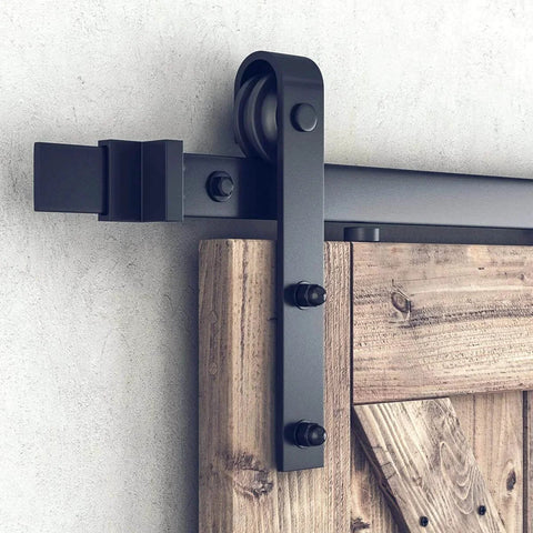 Close-up of 6.8 Foot Sliding Barn Door Hardware Kit With 6.8 Foot Track Kit, Pull Handle Set And Floor Guide For 36 To 40 Inch Doors J Shape Smooth Quiet Operation Easy To Install Black Powder Coated Durable Alloy