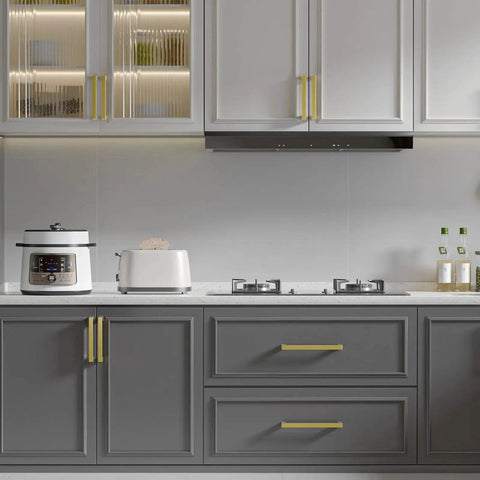 Modern kitchen with gray cabinets featuring 10 Pack 5 Inch Brushed Gold Cabinet Pulls Set For Kitchen Cabinets Modern Handles With Gold Drawer Pulls Stainless Steel Hardware Durable Hollow Construction And Smooth Mounting Holes For Easy Replacement Or Upgrading installed on doors and drawers.